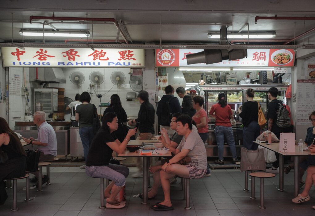 Customers dining at a busy Tiong Bahru hawker centre in Singapore